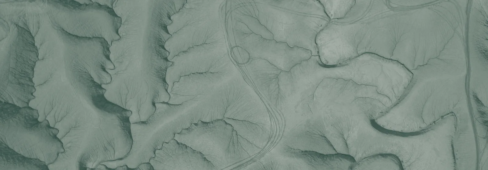 Aerial view of eroded desert drainage patterns